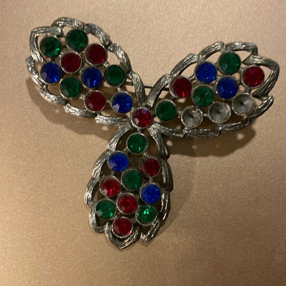 Red/green/blue stones in a gold setting